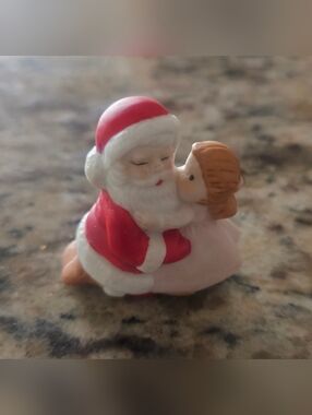 Festive Red and White Santa with Hugging Child